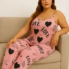 Side angle of satin nightwear set for women, showcasing relaxed-fit pants and soft camisole design.