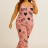Front view of women’s satin pajama set with heart, moon, and rose print, perfect for stylish nightwear.