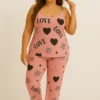 Women’s plus-size satin night suit featuring sleeveless top and printed pajama pants with Love and rose motifs.