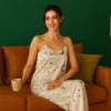 Side angle of sleeveless satin camisole with matching printed pajama pants for women