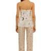 Close-up of moon and star printed satin fabric for women’s nightwear set